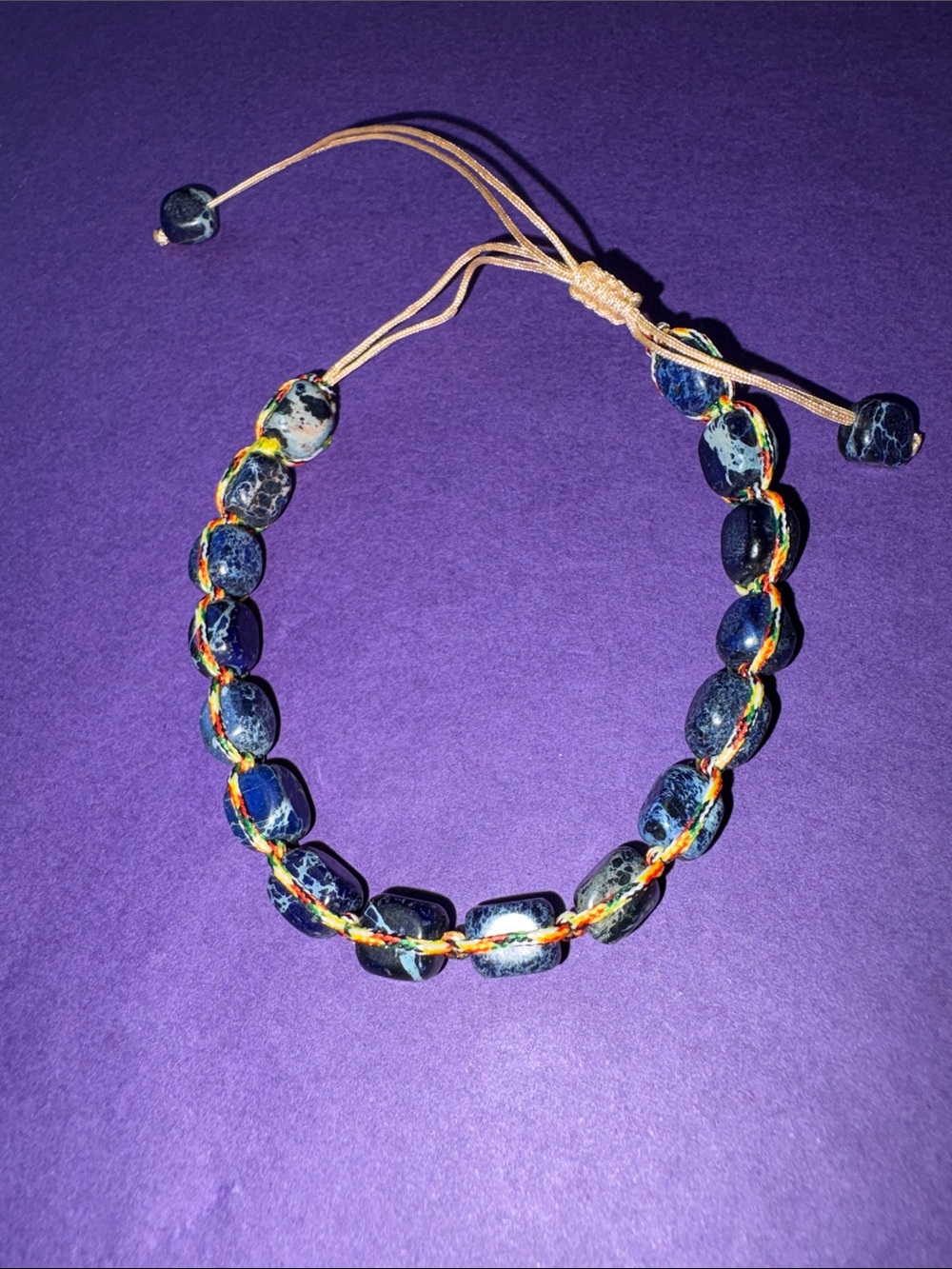 Hand Crafted Navy Blue Beaded Bracelet with Multicolor Braided Cord